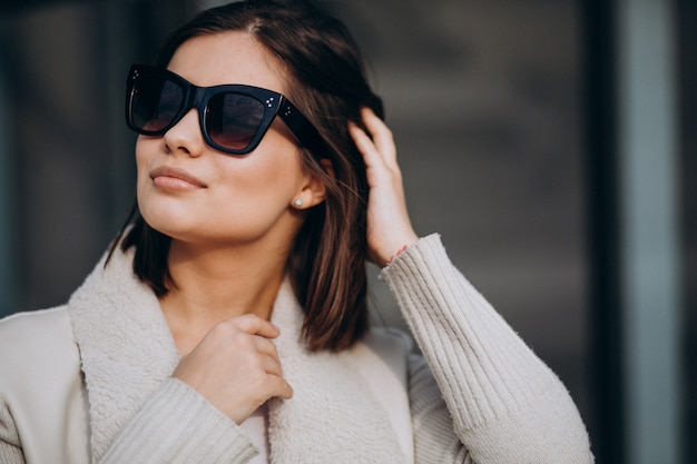 Portrait of young woman in town