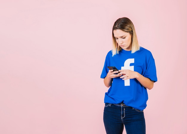 Portrait of a young woman using mobile phone