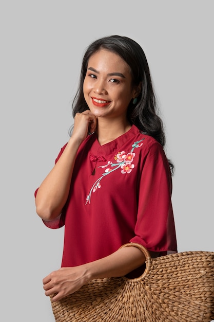 Portrait of young woman wearing embroidered shirt