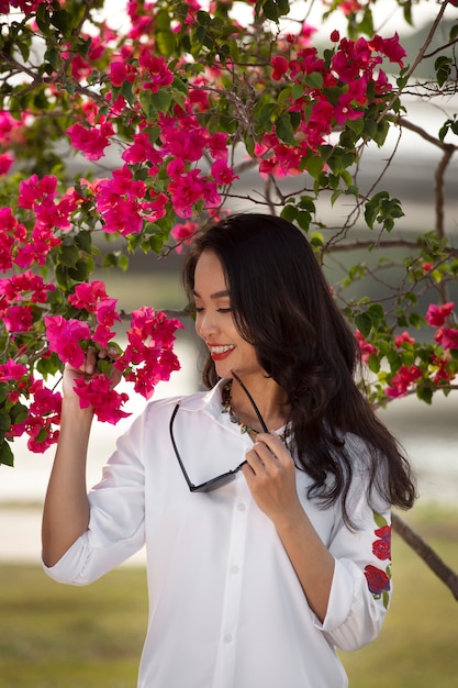 Portrait of young woman wearing embroidered shirt