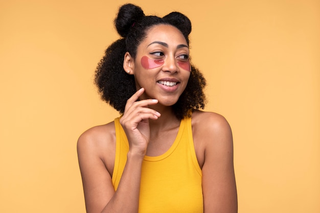 Portrait of a young woman wearing under-eye patches