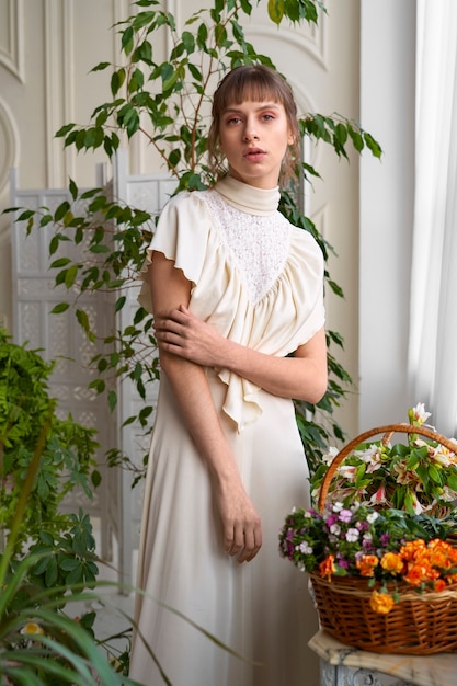 Portrait of young woman with flowers wearing a boho chic dress