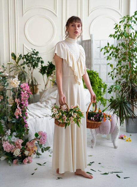 Portrait of young woman with flowers wearing a boho chic dress