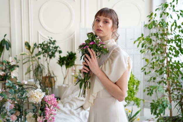 Portrait of young woman with flowers wearing a boho chic dress