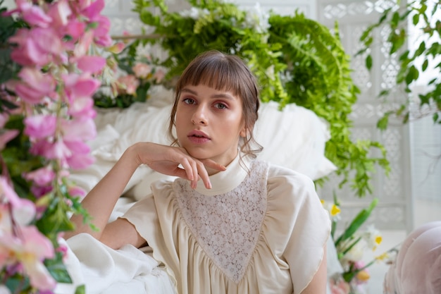 Portrait of young woman with flowers wearing a boho chic dress