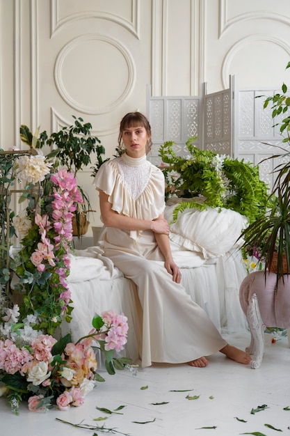 Portrait of young woman with flowers wearing a boho chic dress