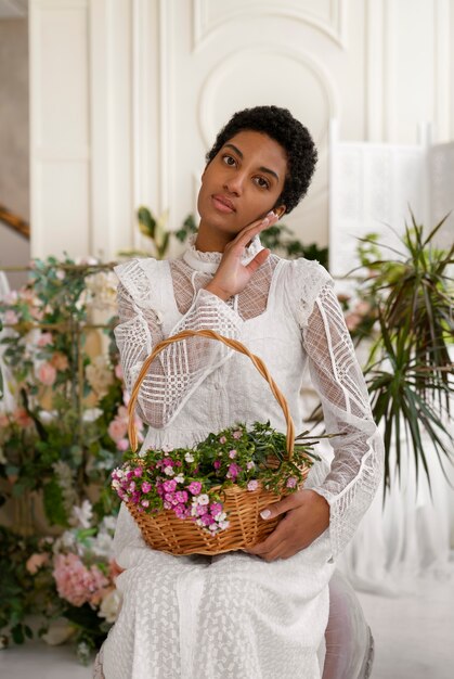 Portrait of young woman with flowers wearing a boho chic dress