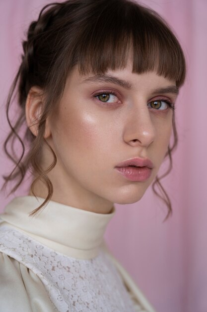 Portrait of young woman with romantic garden aesthetic