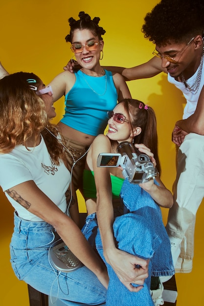 Portrait of young women in 2000s fashion style posing with camera