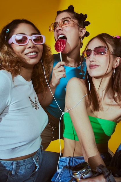 Portrait of young women in 2000s fashion style posing with camera