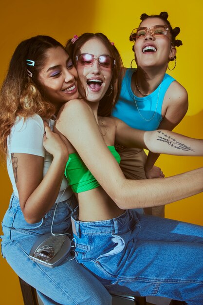 Portrait of young women in 2000s fashion style posing with camera