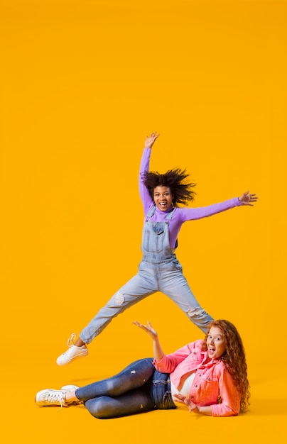 Free Photo portrait young women jumping