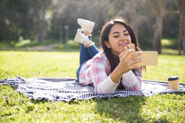 Positive beautiful girl enjoying perfect wireless connection