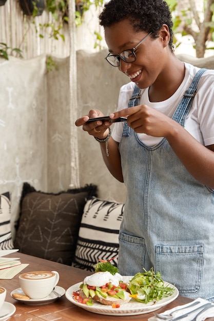 Positive black woman in jean sarafan