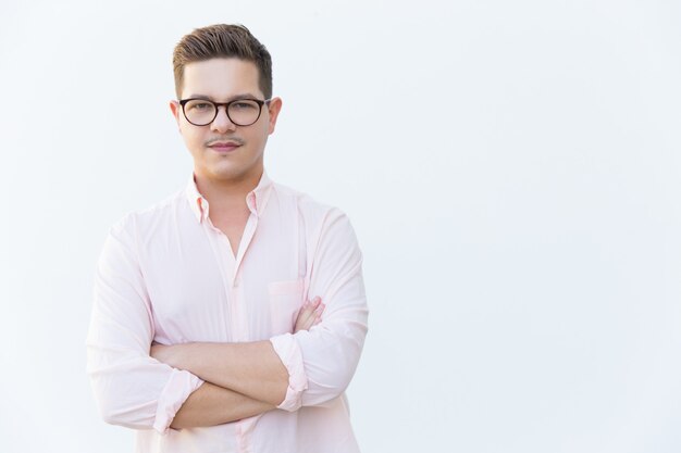 Positive confident entrepreneur posing with arms folded