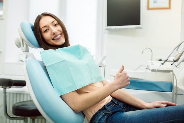 Free photo positive girl in dentist's chair