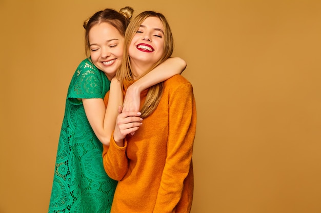 Positive models posing with their dresses