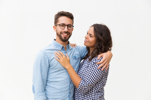 Positive united family couple hugging