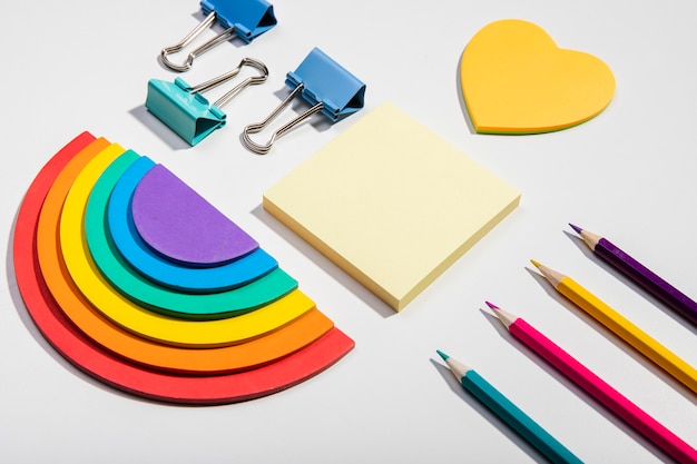 Free photo post-it note cards and school tools and rainbow paper high view