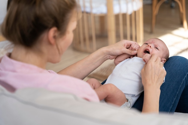 Free photo postnatal period with mother and child