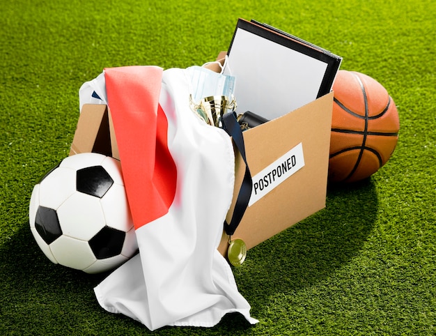 Free photo postponed sports event objects composition in box