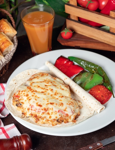 Potato gratin (baked potatoes with cream and cheese) with lavash and grilled red green pepper 