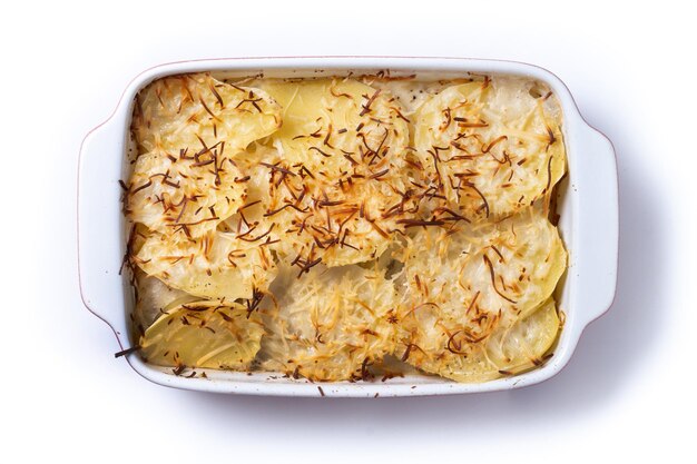 Potato gratin baked with cream and cheese isolated on white background