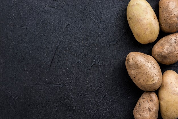 Potatoes on table with copy-space