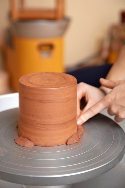 Free Photo pottery craftsperson in the studio creating ceramics