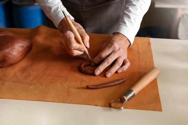 Free photo pottery craftsperson in the studio creating ceramics