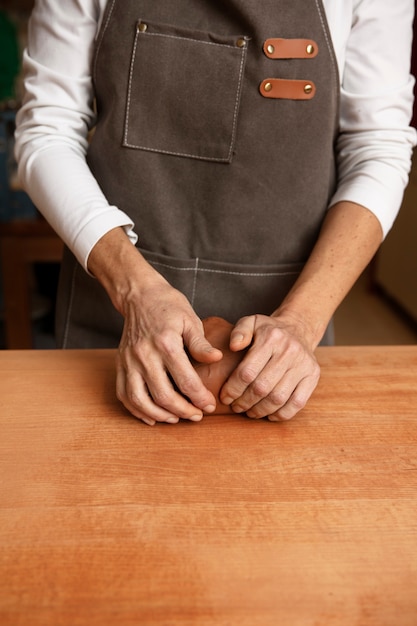 Pottery craftsperson in the studio creating ceramics