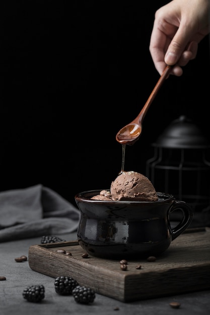 Pouring topping on ice cream process