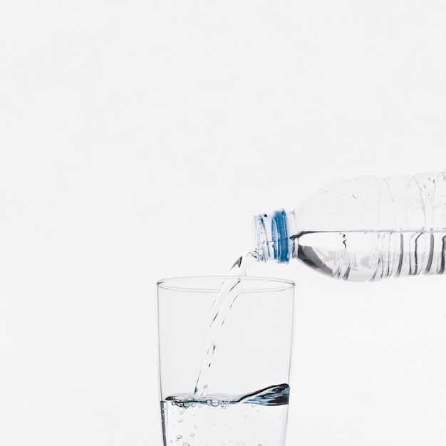 Pouring water into glass