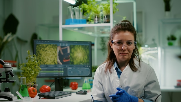 Free Photo pov of chemist woman in white coat analyzing with biologists team during online videocall