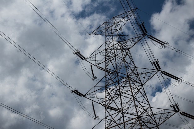 Free photo power lines with clouds in the background