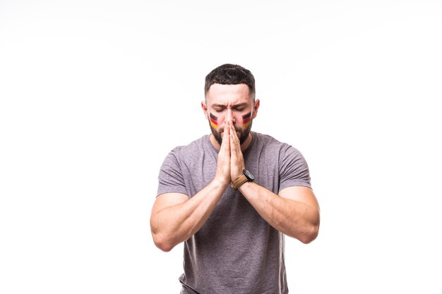 Pray for Germany. Germany football fan pray for game of Germany national team on white background. Football fans concept.