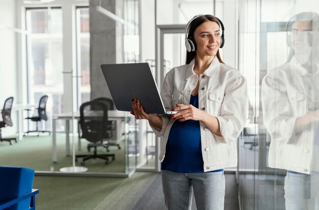 Pregnant woman working in a company