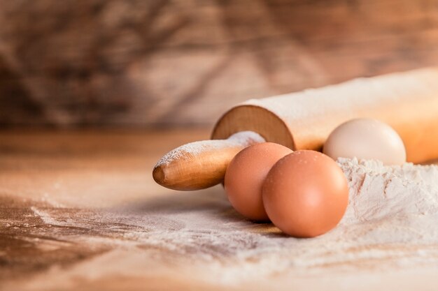 Preparation ingredients for baking on wood background