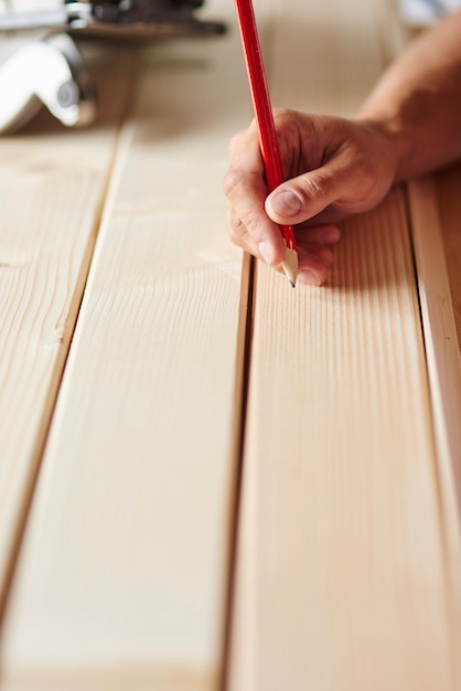 Free Photo preparation of wooden planks by carpenter