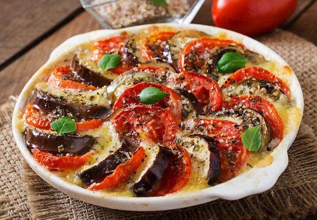 Free Photo prepared gratin dish raw eggplant with mozzarella and tomatoes