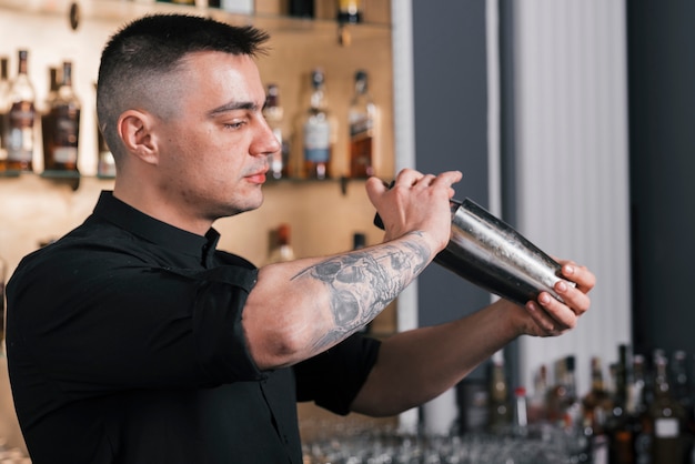 Preparing a refreshing cocktail in a bar