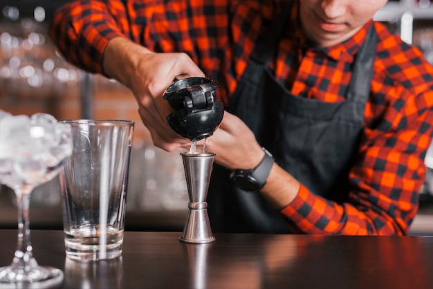 Preparing a refreshing cocktail in a bar