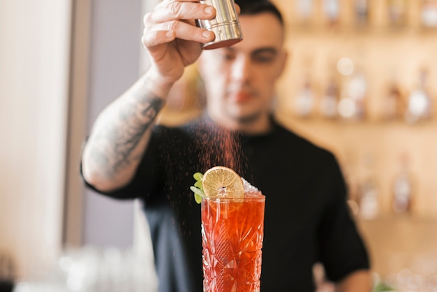 Preparing a refreshing cocktail in a bar