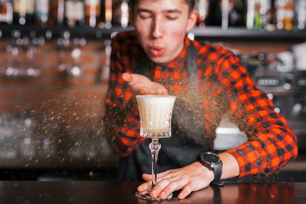 Preparing a refreshing cocktail in a bar