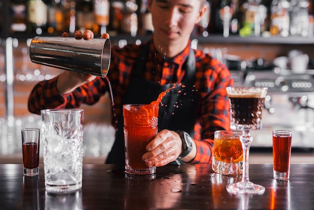 Preparing a refreshing cocktail in a bar