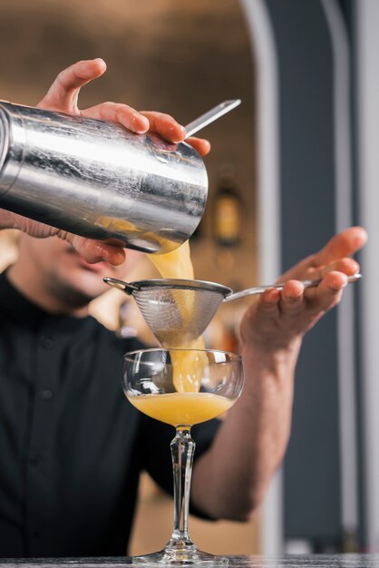 Preparing a refreshing cocktail in a bar