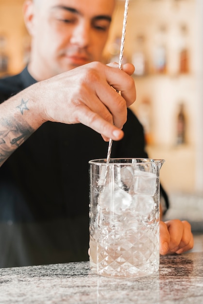 Preparing a refreshing cocktail in a bar