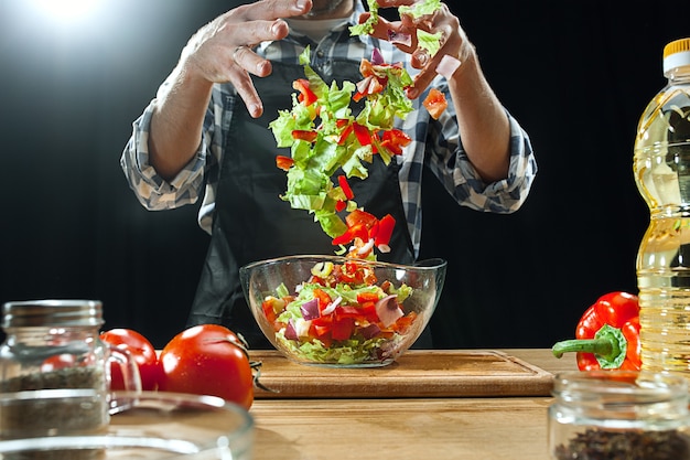 Free Photo preparing salad. female chef cutting fresh vegetables.