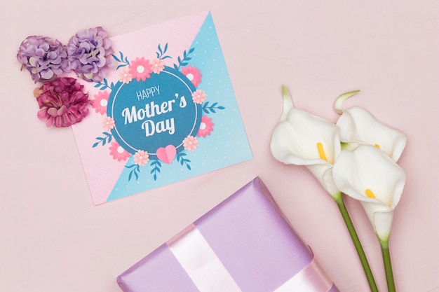 Present with flowers and card for mothers day