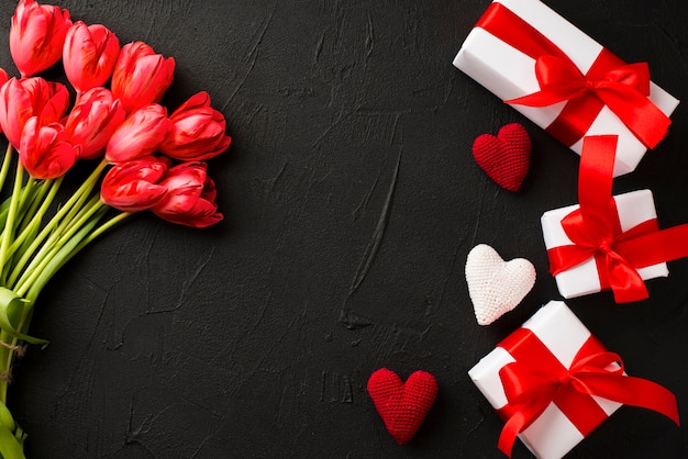 Presents and bouquet on dark background